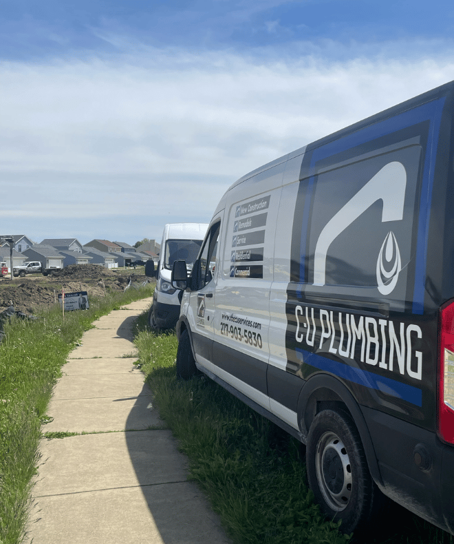 C-U Plumbing service van on a job site in Champaign-Urbana, IL